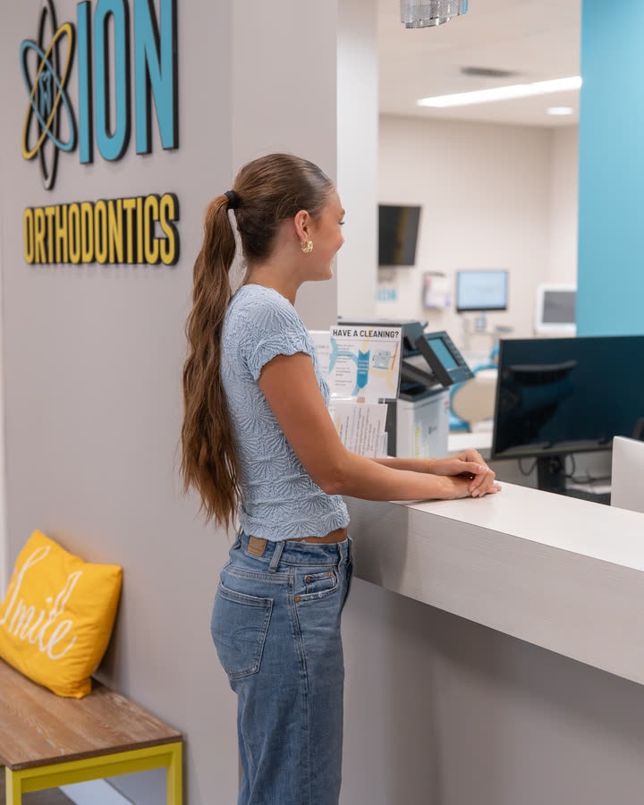 A patient checking in at the ION Orthodontics front desk in Port St. Lucie