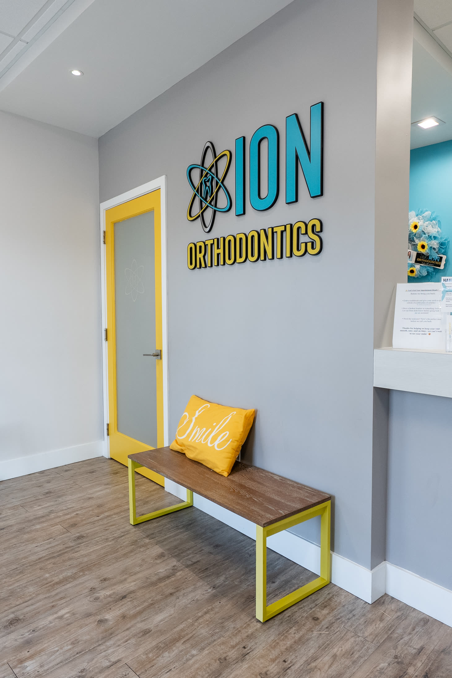 ION Orthodontics lobby with the logo wall and smile bench in Port St. Lucie